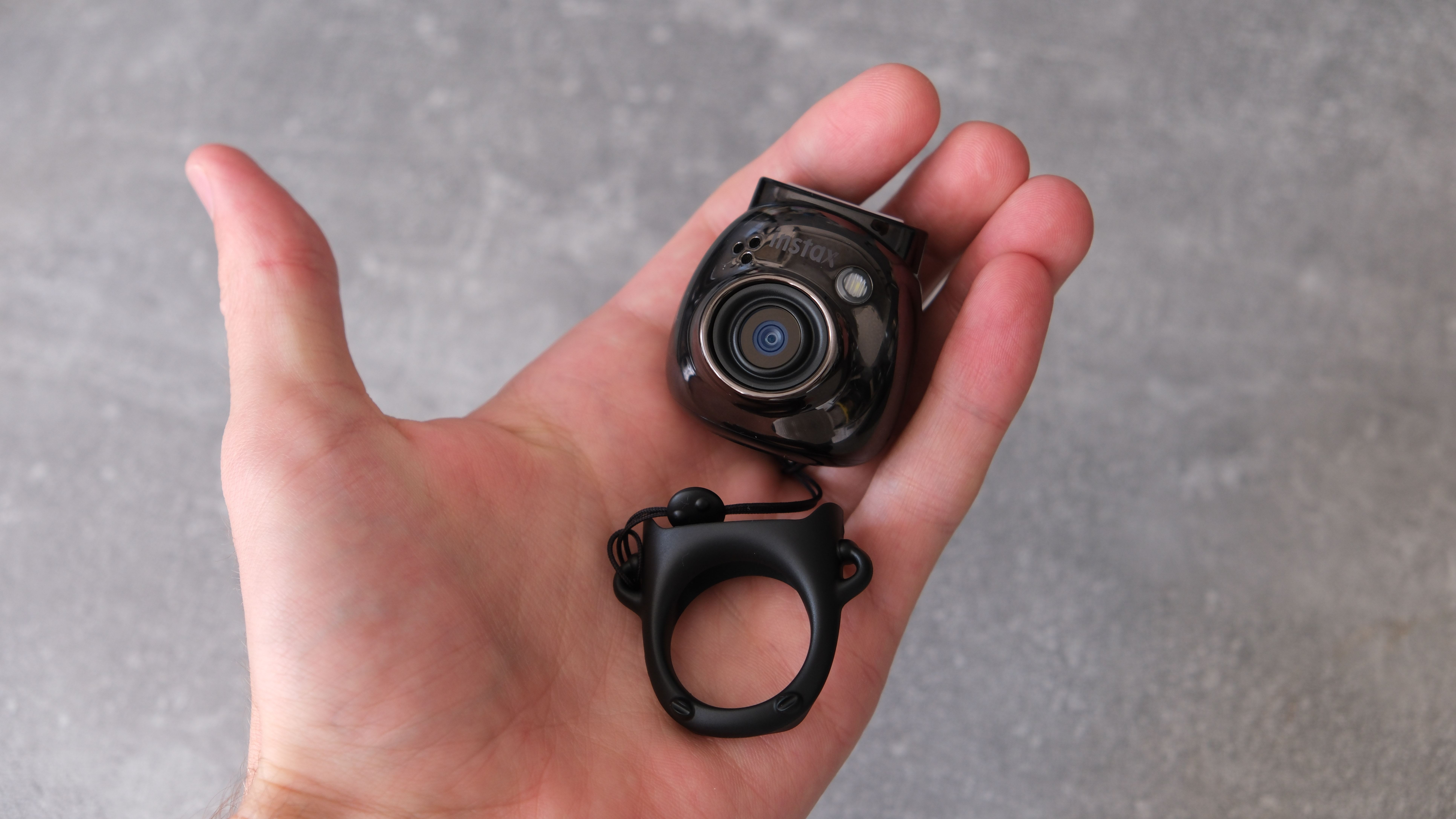 Instax Pal camera in a hand