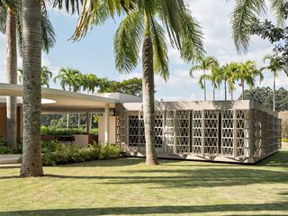 casa das palmeiras with its minimalist, low, white forms, curved openings and indoor/outdoor relationships in sao paulo's warm climate lifestyle