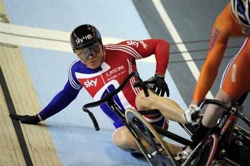 Chris Hoy picks himself up after crashing in the men's keirin.