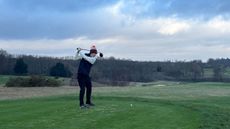 Jonny Leighfield hits a drive off the first tee at The London Club's International Course during Golf Monthly's Christmas event 2025
