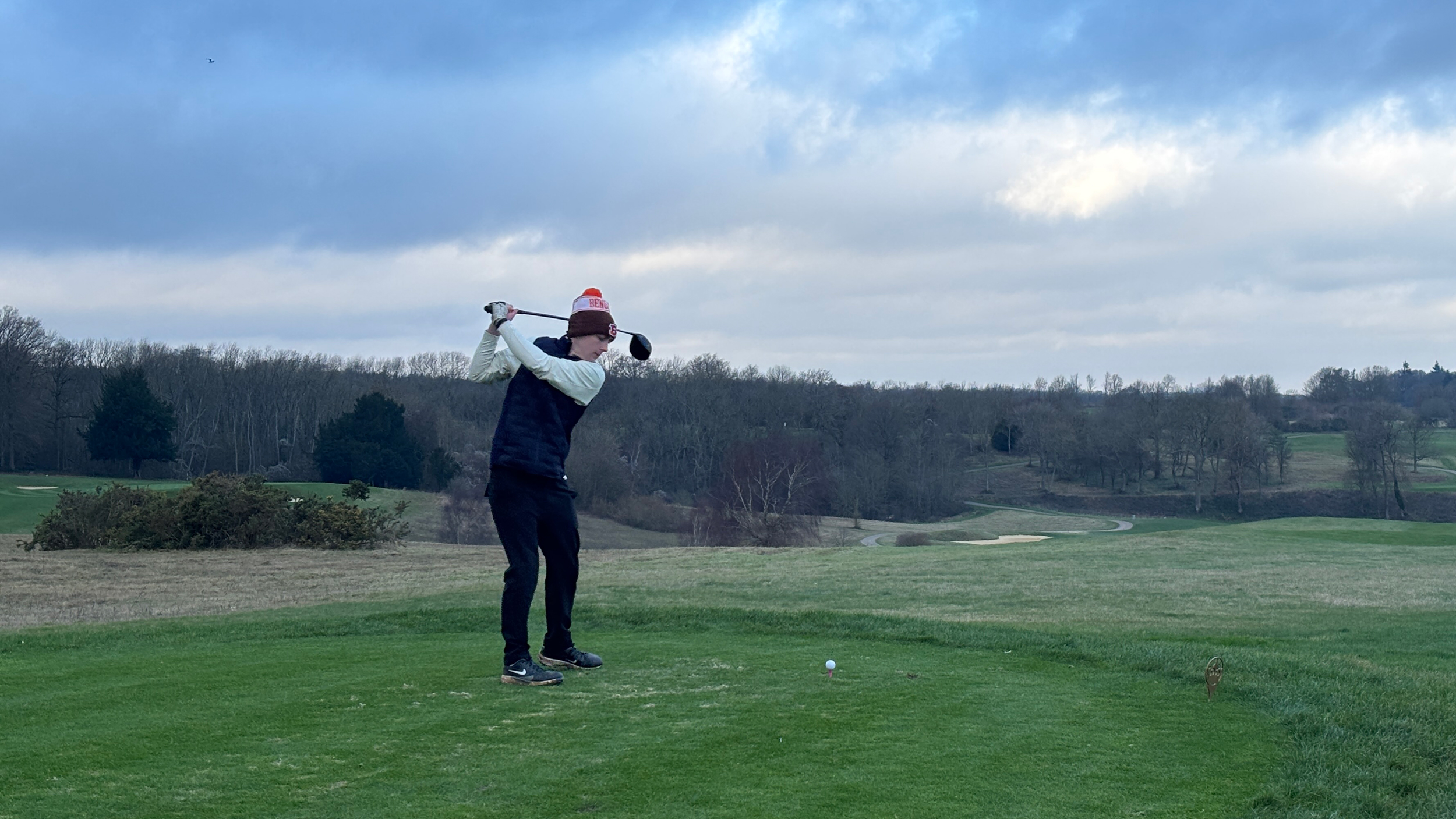 Jonny Leighfield hits a drive off the first tee at The London Club's International Course during Golf Monthly's Christmas event 2025