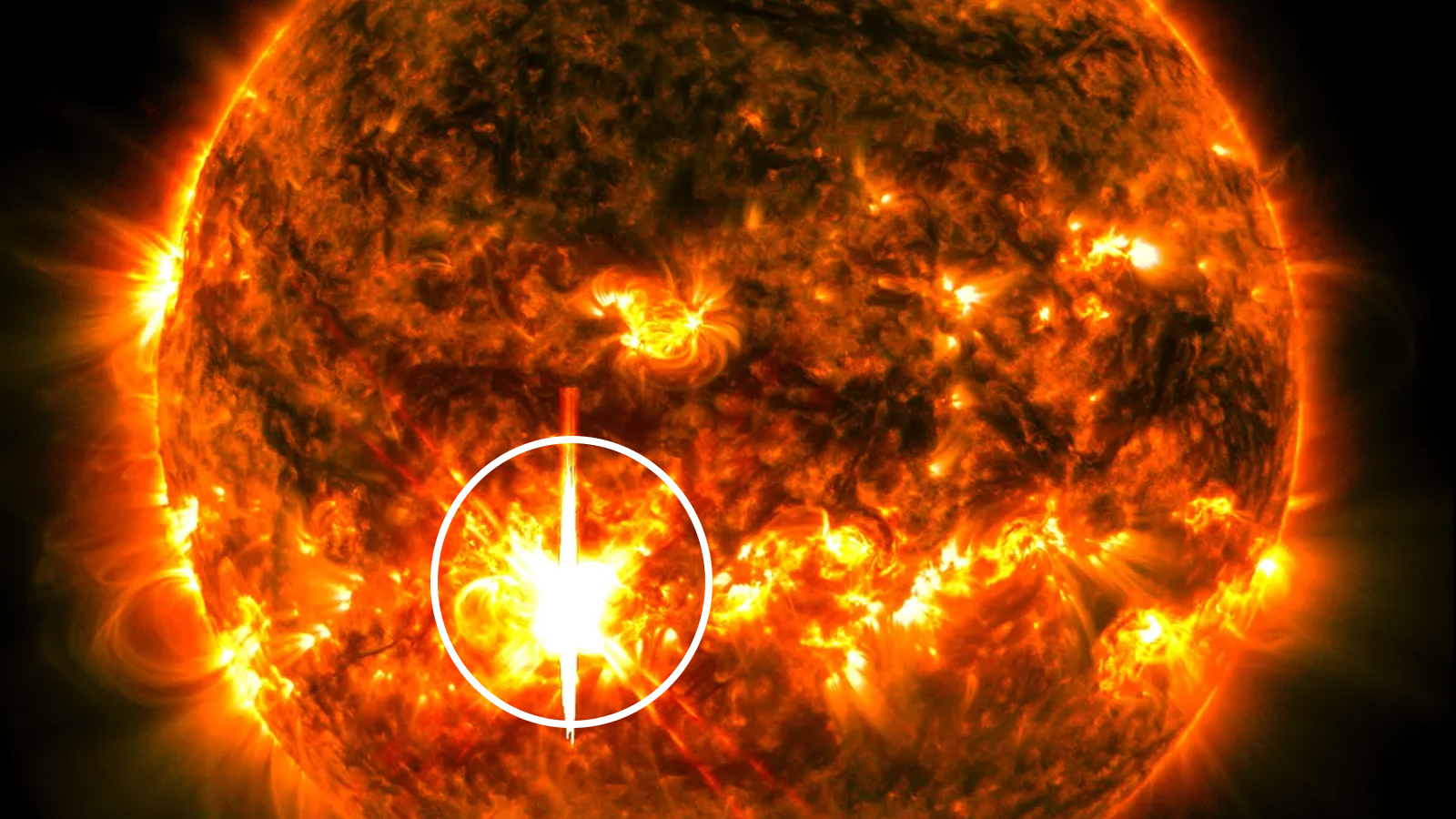 A photo of the Sun showing a bright flash on its surface