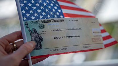 picture of relief program check and American flag