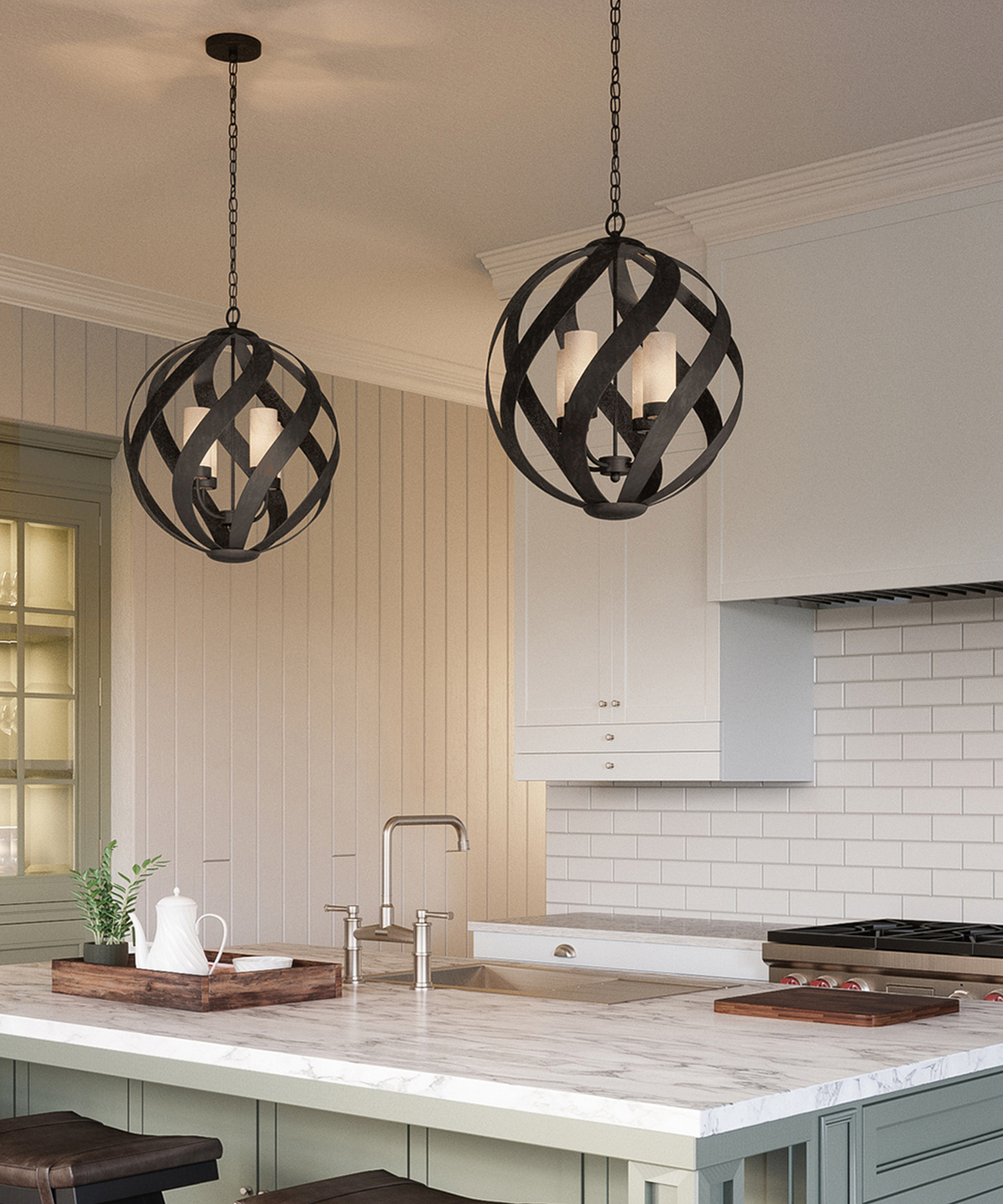 two large metal fretwork style pendant lights above kitchen island with candle style lighting inside pendant light