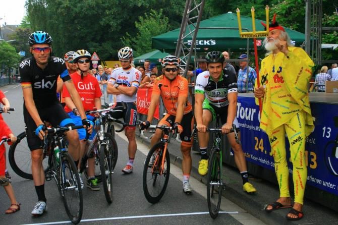 Riders await the start of the Tour de Neuss