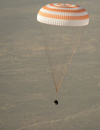 Soyuz Capsule with Expedition 36 Crew Glide Over Kazakhstan