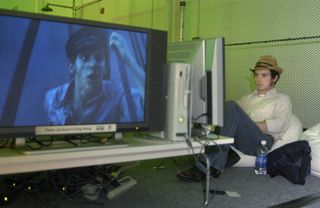 Elijah Wood plays an Xbox 360 in 2005.