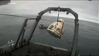 A SpaceX Dragon capsule carrying the Ax-3 astronauts is recovered from the Atlantic Ocean after splashdown on Feb. 9, 2024.