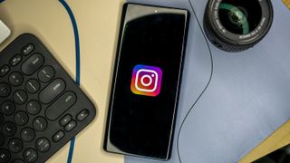 Instagram logo on a smartphone lying flat on a table