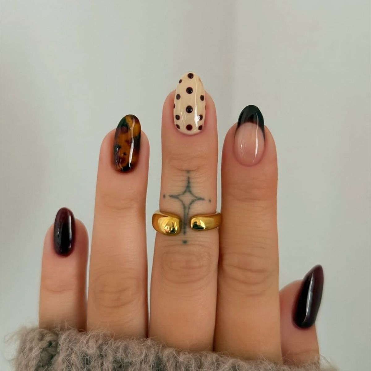A moody, fall-themed manicure by Charlotte Cliff