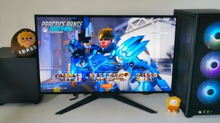 Corsair Xeneon 27QHD240 on desk with Pharah from Overwatch 2 on screen