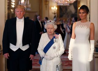 Queen Elizabeth, Donald Trump, and Melania Trump pose for a photograph ahead of a State Banquet in the ballroom at Buckingham Palace in central London on June 3, 2019.