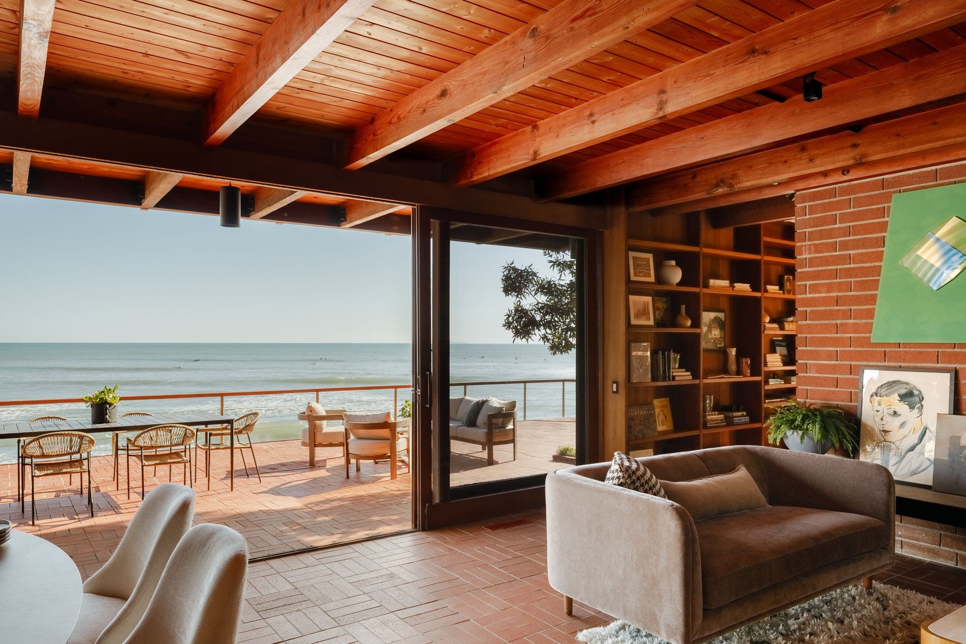 The living areas open onto a beachside terrace