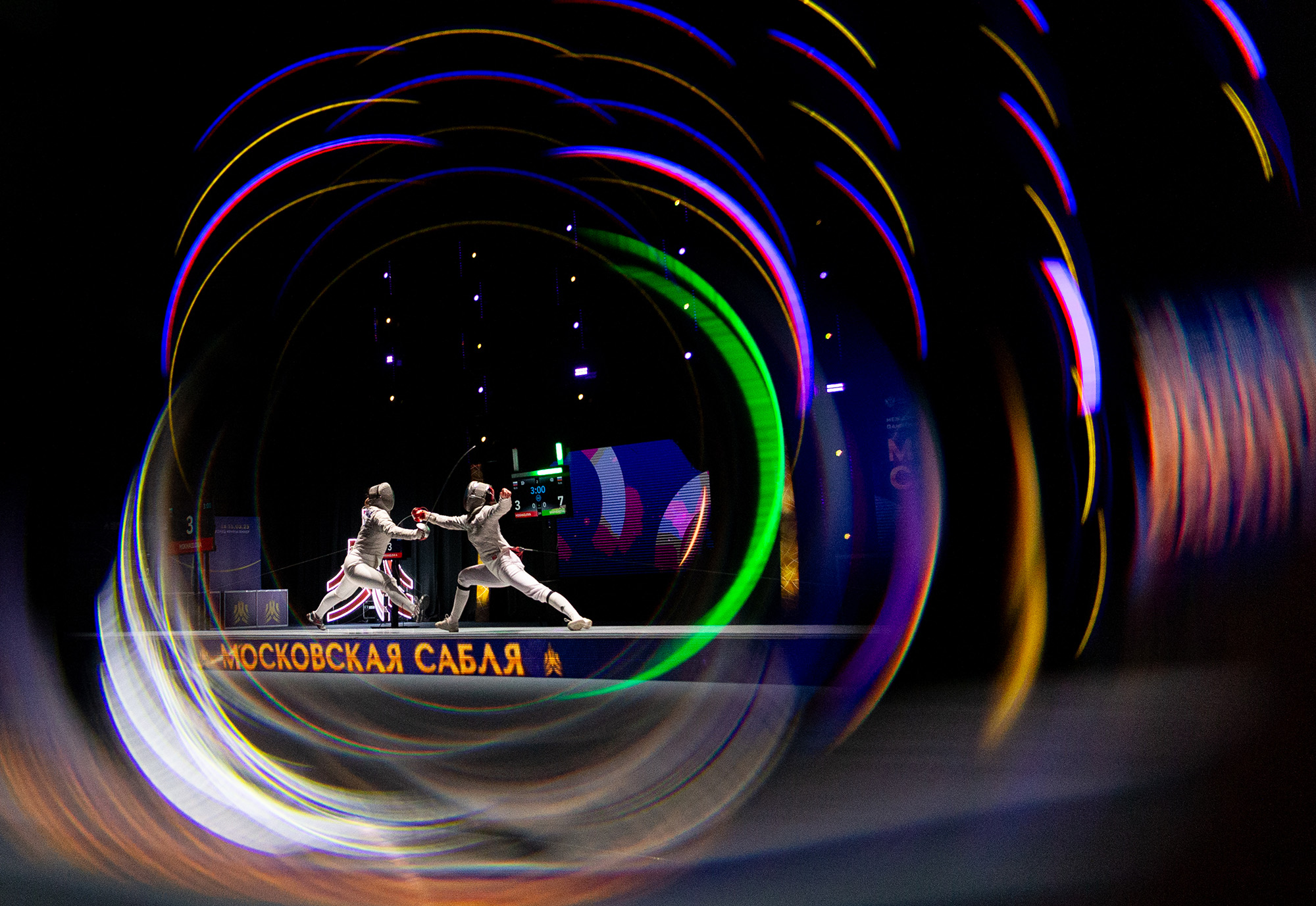 Two fencers surrounded by colorful swirls