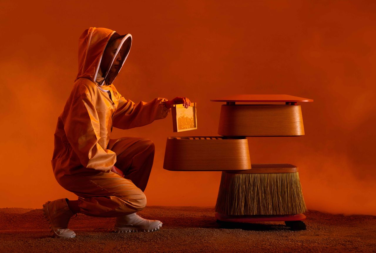 furniture, clothing and accessories on orange backdrop