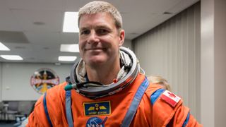 astronaut smiling in a spacesuit
