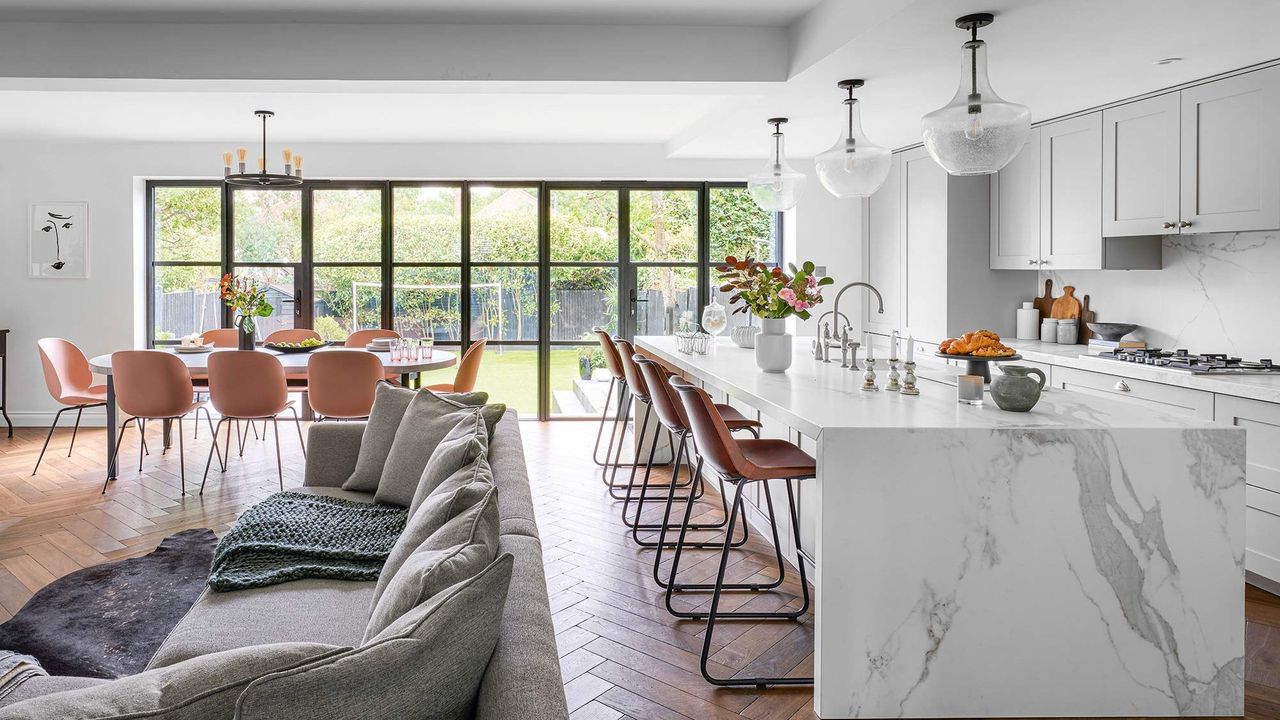 living diner area with sofa cushions and bar stools