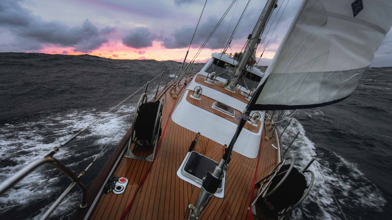 A sailboat sails into a storm.