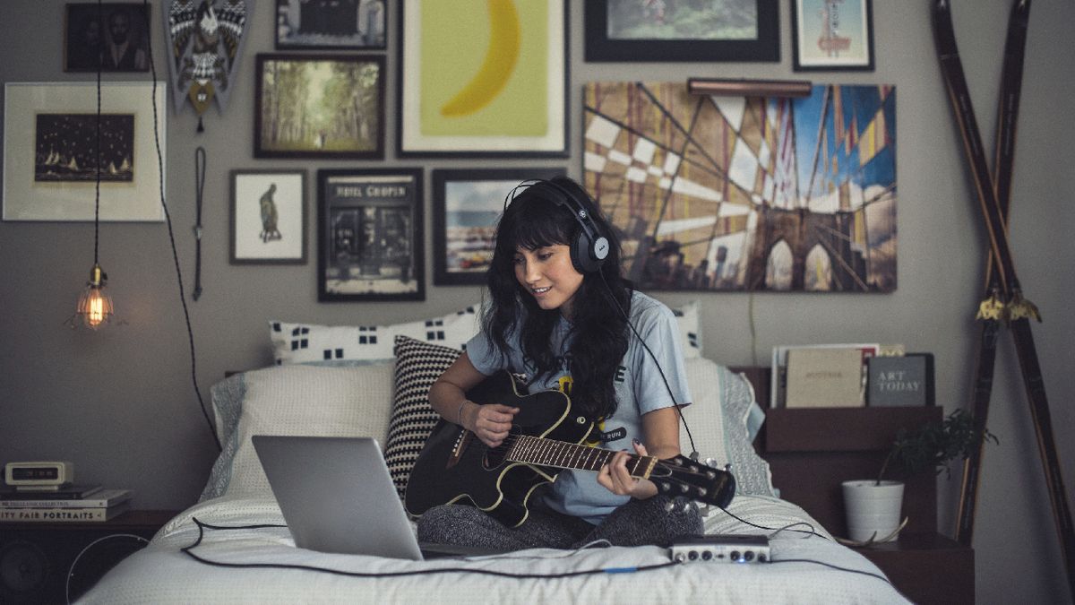 AKG K72 being worn by a guitarist