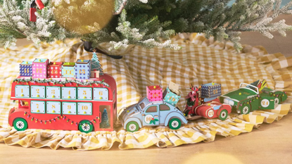 Anthropologie holiday 2025 collection, featuring an ochre gingham Christmas tree skirt and retro-style holiday figurines