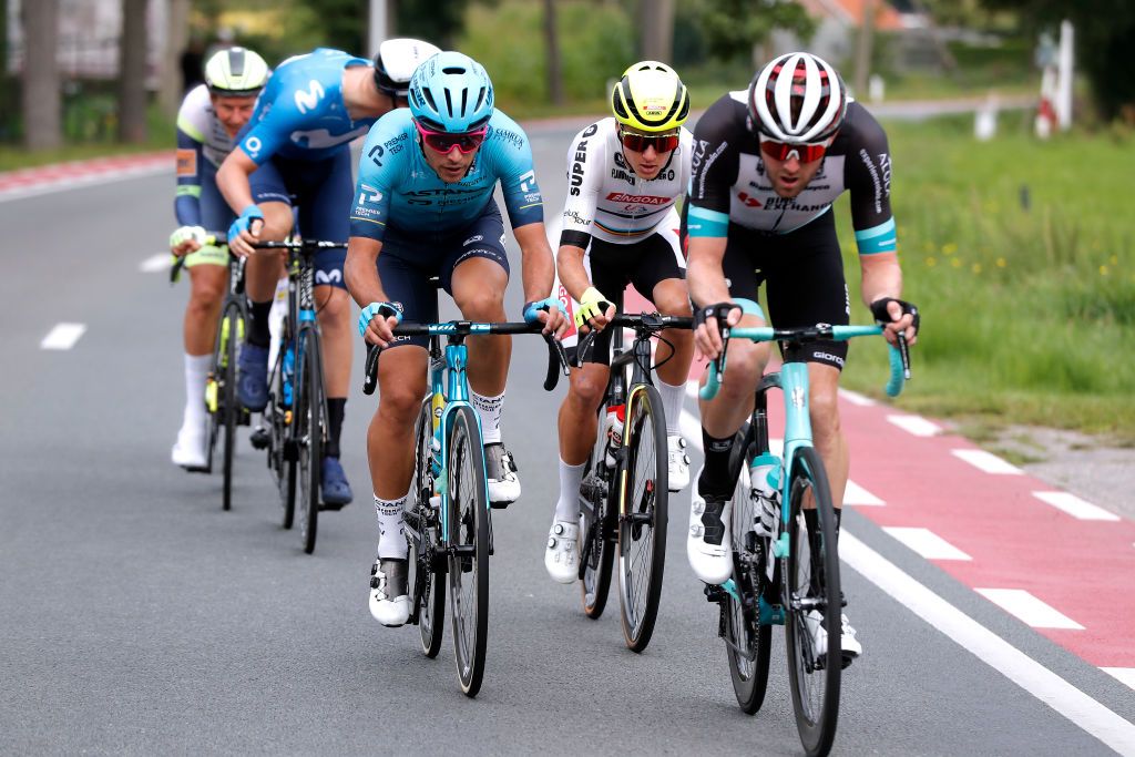 HOOGERHEIDE NETHERLANDS SEPTEMBER 01 LR Samuele Battistella of Italy and Team Astana Premier Tech Arjen Livyns of Belgium and Team Bingoal WB White Combativity Jersey and Luke Durbridge of Australia and Team BikeExchange compete in the Breakaway during the 17th Benelux Tour 2021 Stage 3 a 1683km stage from Essen to Hoogerheide BeneluxTour on September 01 2021 in Hoogerheide Netherlands Photo by Bas CzerwinskiGetty Images