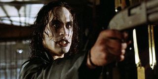 The Crow Brandon Lee wielding an angry shotgun