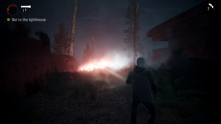 An image of Alan Wake in a dark forest with a flare in the distance