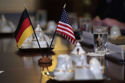 U.S. and German flags.