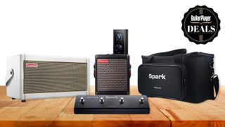 A selection of Positive Grid smart amps and accessories on a wooden desk