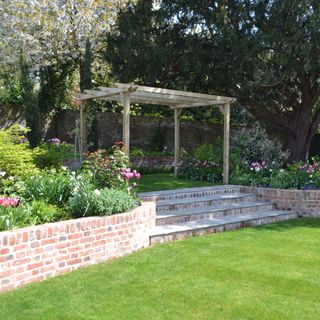 lawn with steps and wooden pergola