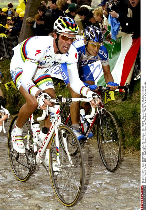 World Champion Mario Cipollini dwarfs Tom Boonen in the 2003 Tour of Flanders