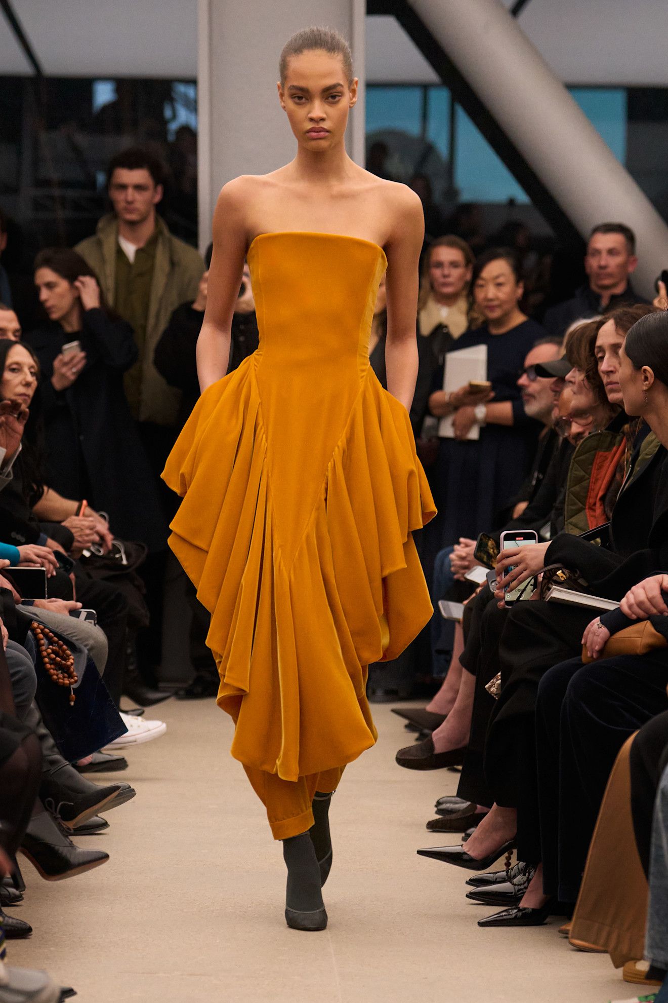 Photo of model wearing basque waist trend during Paris Fashion Week Fall Winter 2026 runway show.