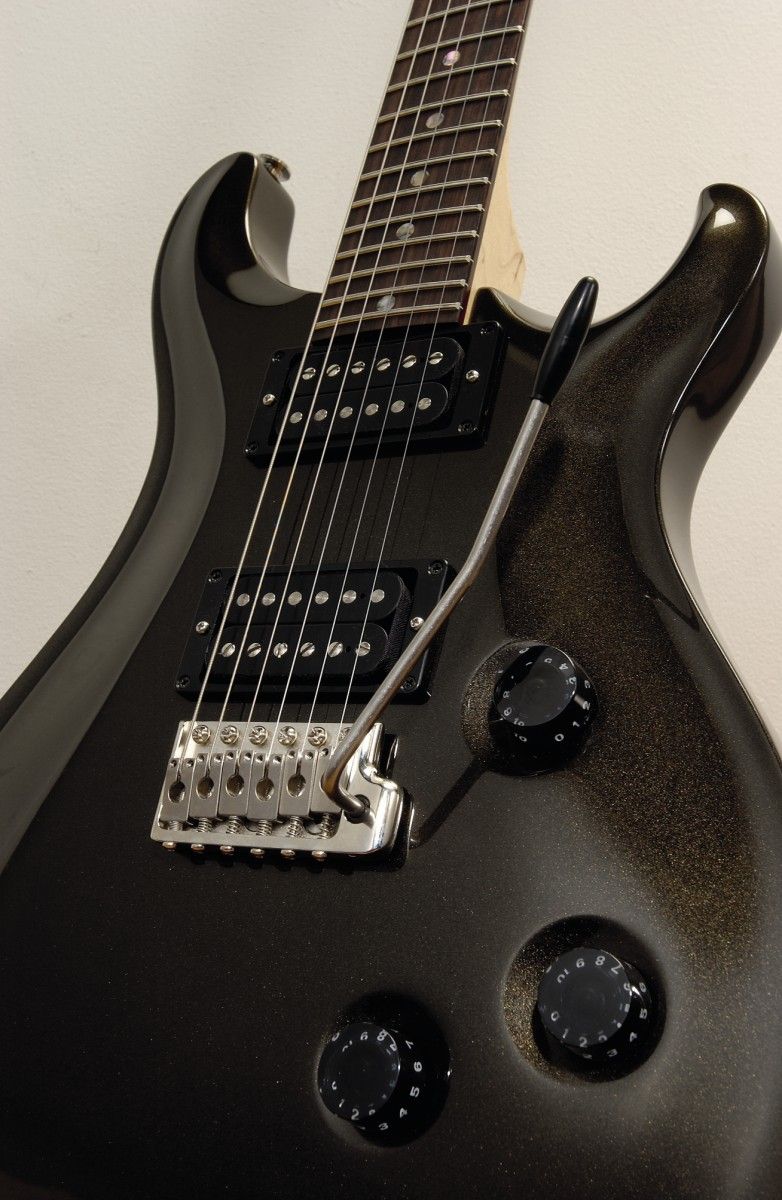 The knob behind the bridge is actually a five-way pickup selector