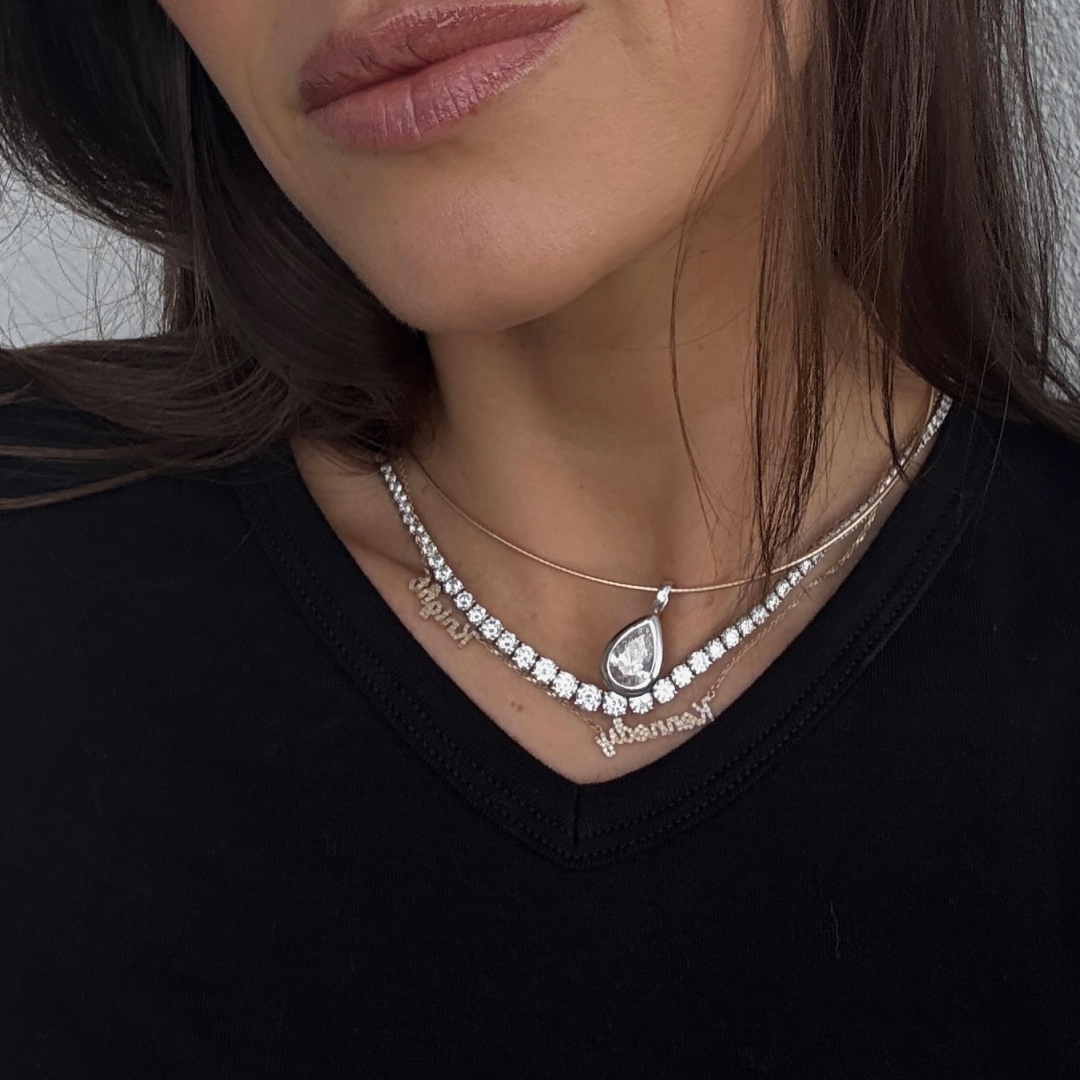 Kira Mackenzie Jackson wears a stack of diamond necklaces