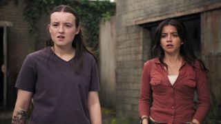 Ellie and Dina standing and looking shocked in The Last of Us season 2 episode 4