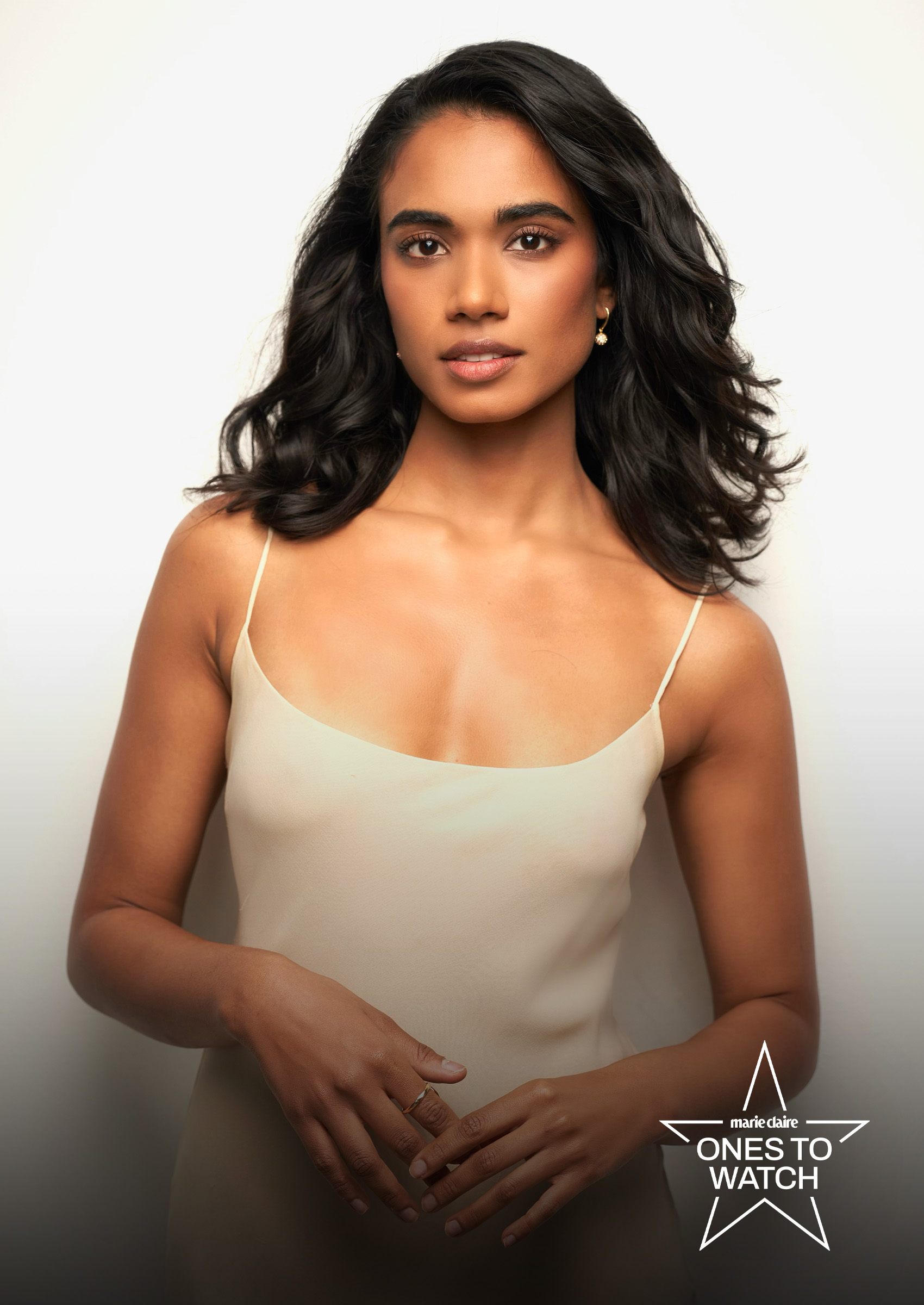 actress supriya ganesh poses in a nude slip against a white backdrop