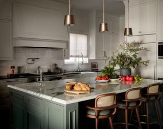 warm white kitchen with sage green island