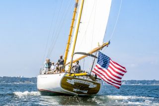 The Madeleine schooner with an American flag sails in Newport Harbor in Rhode Island