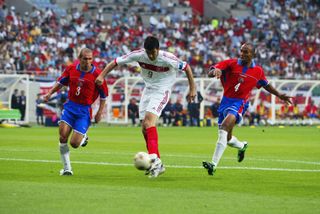 Hakan Sukur (centre) takes a shot for Turkey against Costa Rica at the 2002 World Cup.