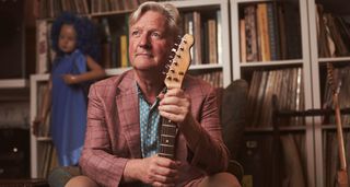 Squeeze frontman and guitarist Glenn Tilbrook pictured at home