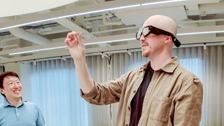 Snapchat Spectacles being worn on person playing around with others in an office space