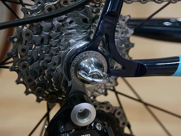 The vertical dropouts display a variation on Courage's stainless steel-faced theme.