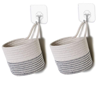A pair of hanging storage baskets in grey and white with included adhesive hooks