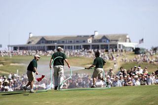 Greens crews water the 7th green at the 2004 US Open