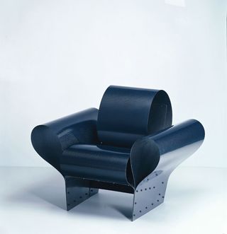 Bad-Tempered Chair, 2002. A black leather chair with a black steel frame.