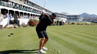 Brooks Koepka of the United States plays a tee shot on the 16th hole during practice rounds prior to the WM Phoenix Open 