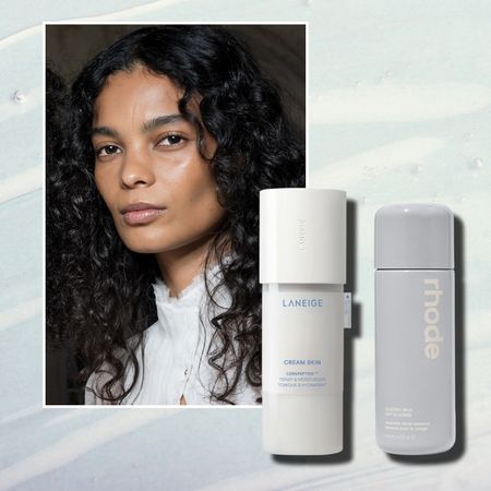 a woman with glowing skin on a milky blue background next to two bottles of milky toner