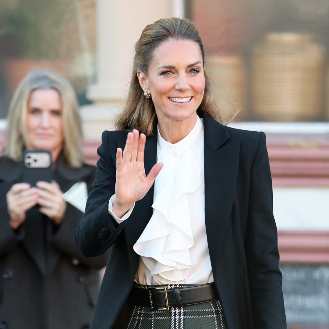 Princess Kate waving in a white blouse and black coat