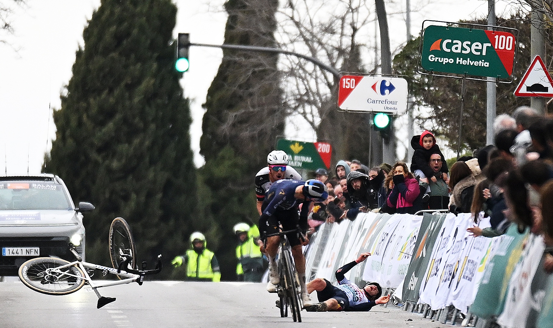 UBEDA, SPAIN - FEBRUARY 16: A general view of Thomas Pidcock of Great Britain and Team Pinarello Q36.5 Pro Cycling and Jan Christen of Switzerland and UAE Team Emirates - XRG sprint at finish line while Maxim Van Gils of Belgium and Team Red Bull - BORA - hansgrohe reacts after crashing at the finish line during the 5th Clasica Jaen Paraiso Interior 2026 a 154.2km one day race from Ubeda to Ubeda on February 16, 2026 in Ubeda, Spain. (Photo by Dario Belingheri/Getty Images)