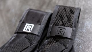 BlackRapid's Sport Breathe (left) features holes punched in its padding for breathability and has a bright white logo too. The BlackRapid Blackline I (right) has larger slits in its padding for even better comfort and breathability and has a blacked-out logo for a more discreet look.